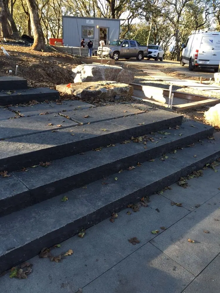 Stairs with black split face exposed as riser