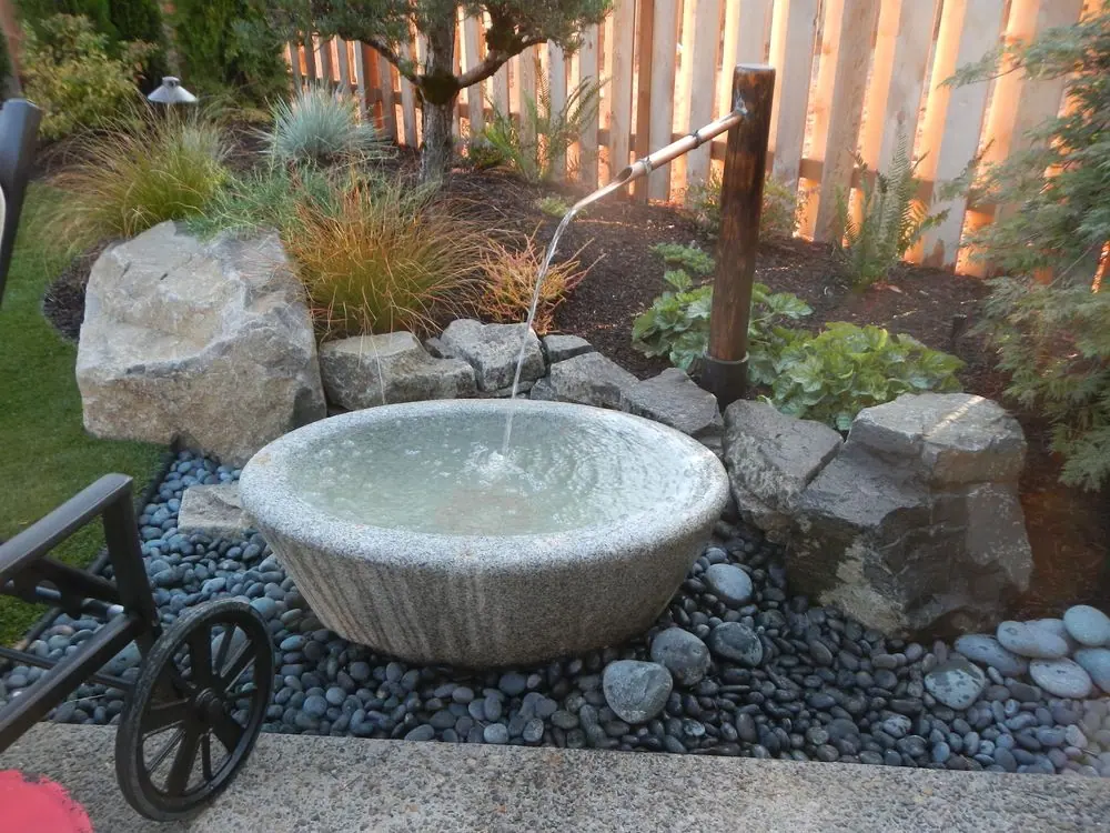 Accent boulders flanking a Kakehi Water Spout